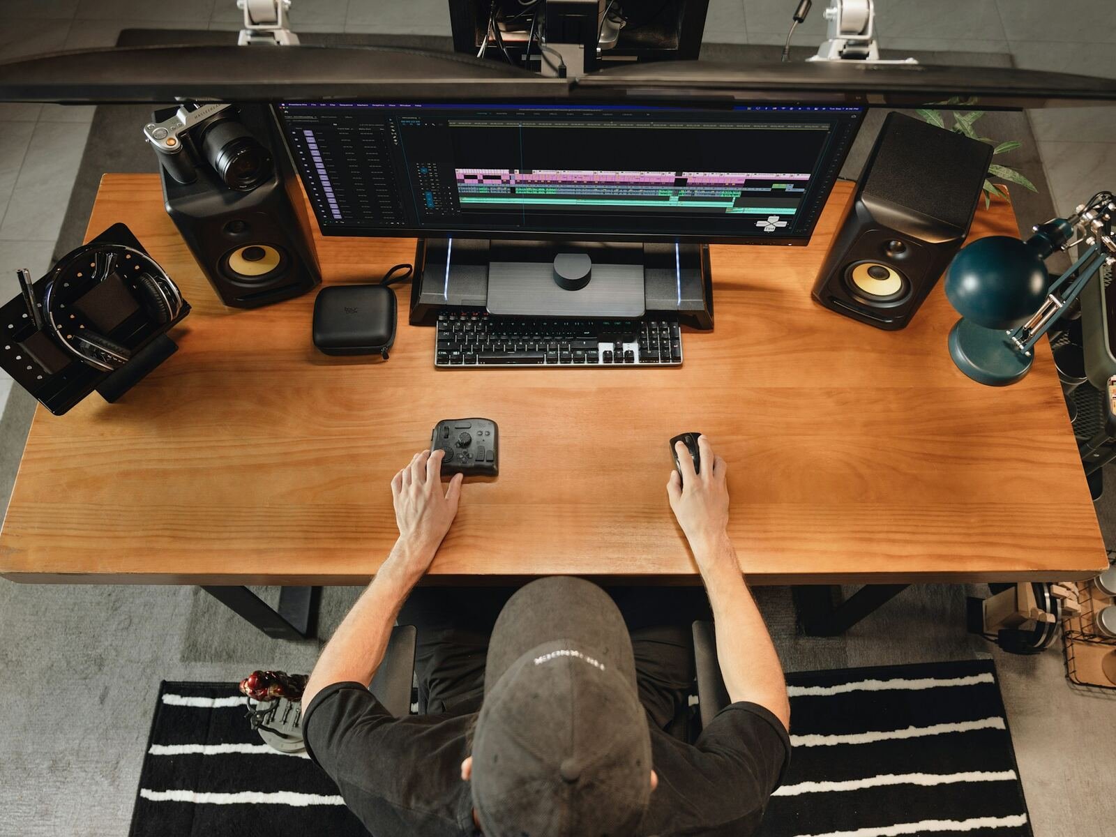Video editor working at a professional desktop workstation